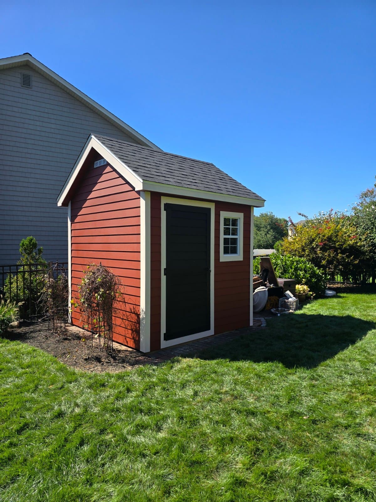 A real 8x8 Traditional with clapboard siding, built onsite in Cumberland, RI